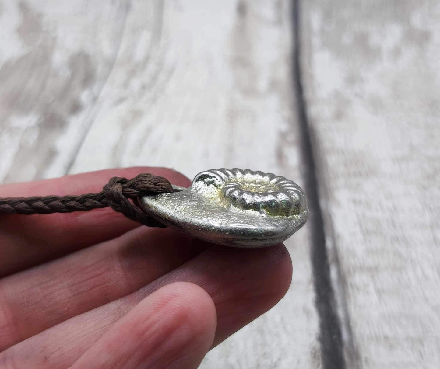 Pewter metal cast ammonite pendant.