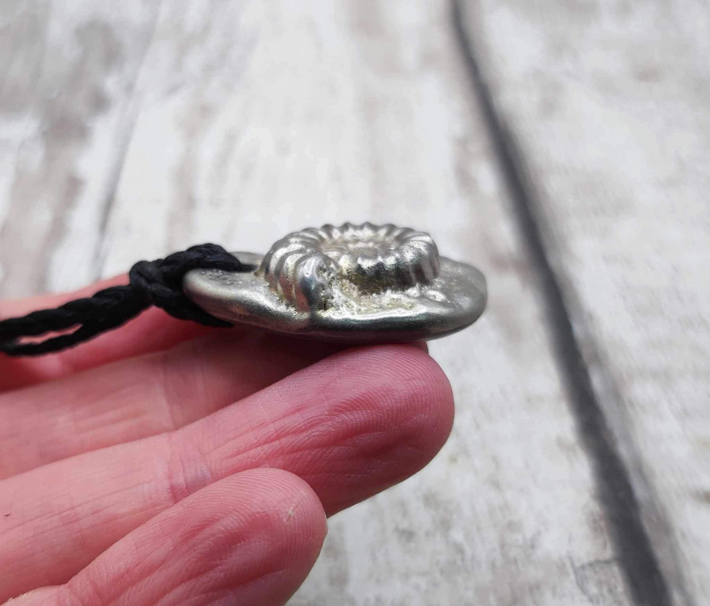 Solid pewter ammonite cast pendant.