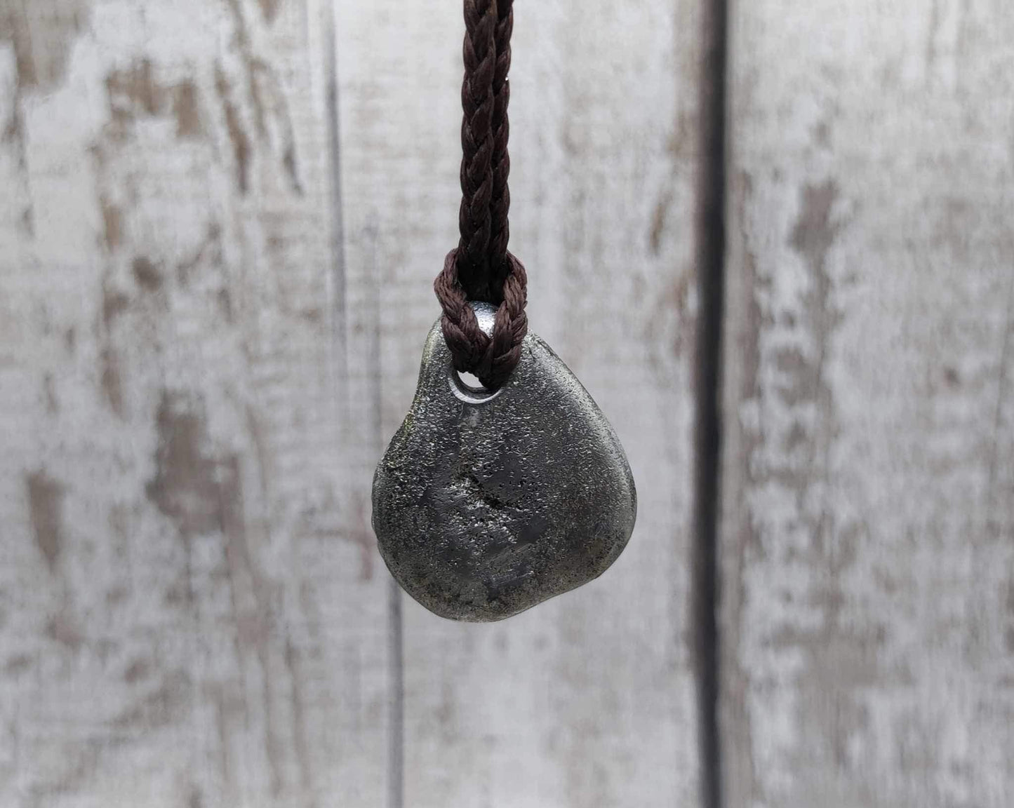 Pewter metal cast ammonite pendant.