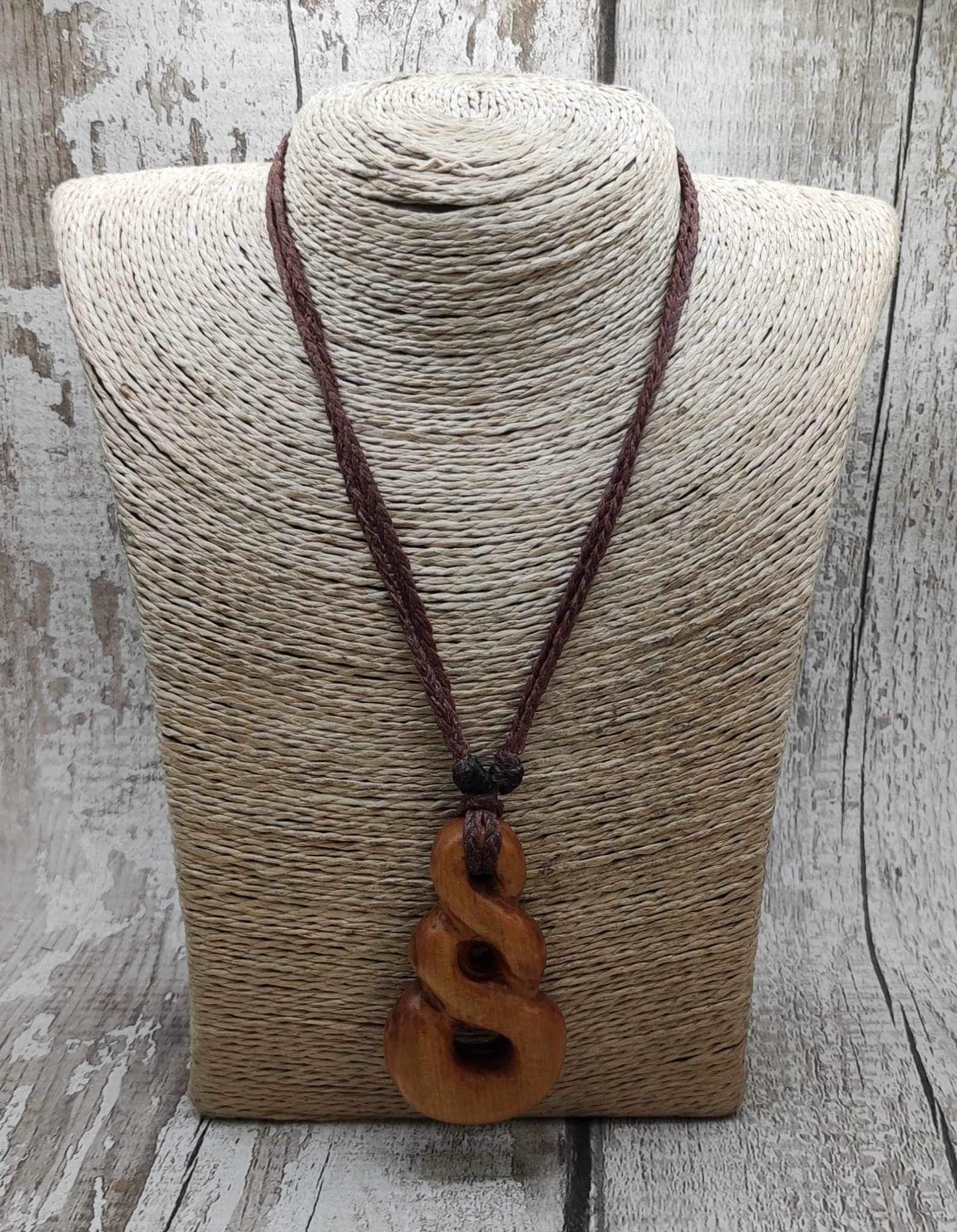 New Zealand Rimu wood pink ours infinity pendant.