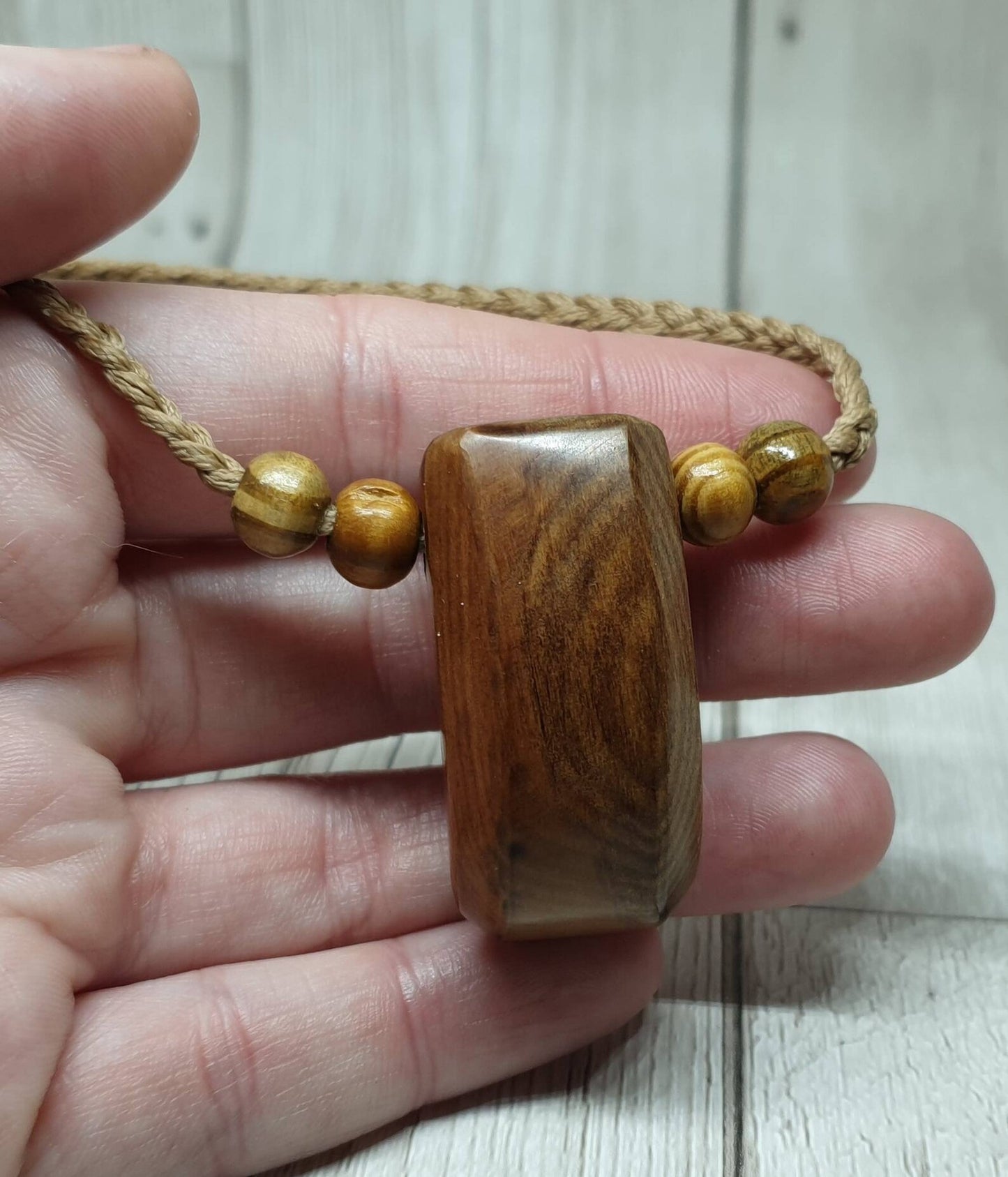 New Zealand Rimu wood unisex pendant.