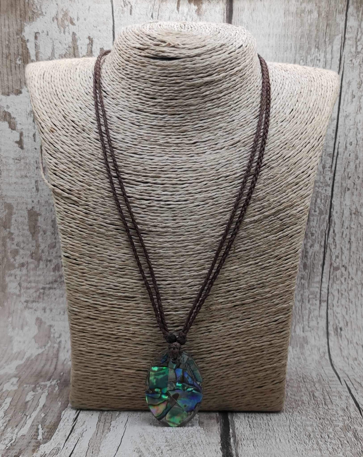 New Zealand Pāua in UV resin pendant.