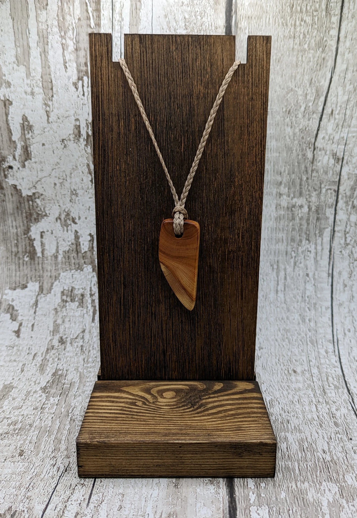 Yew wood slice pendant.