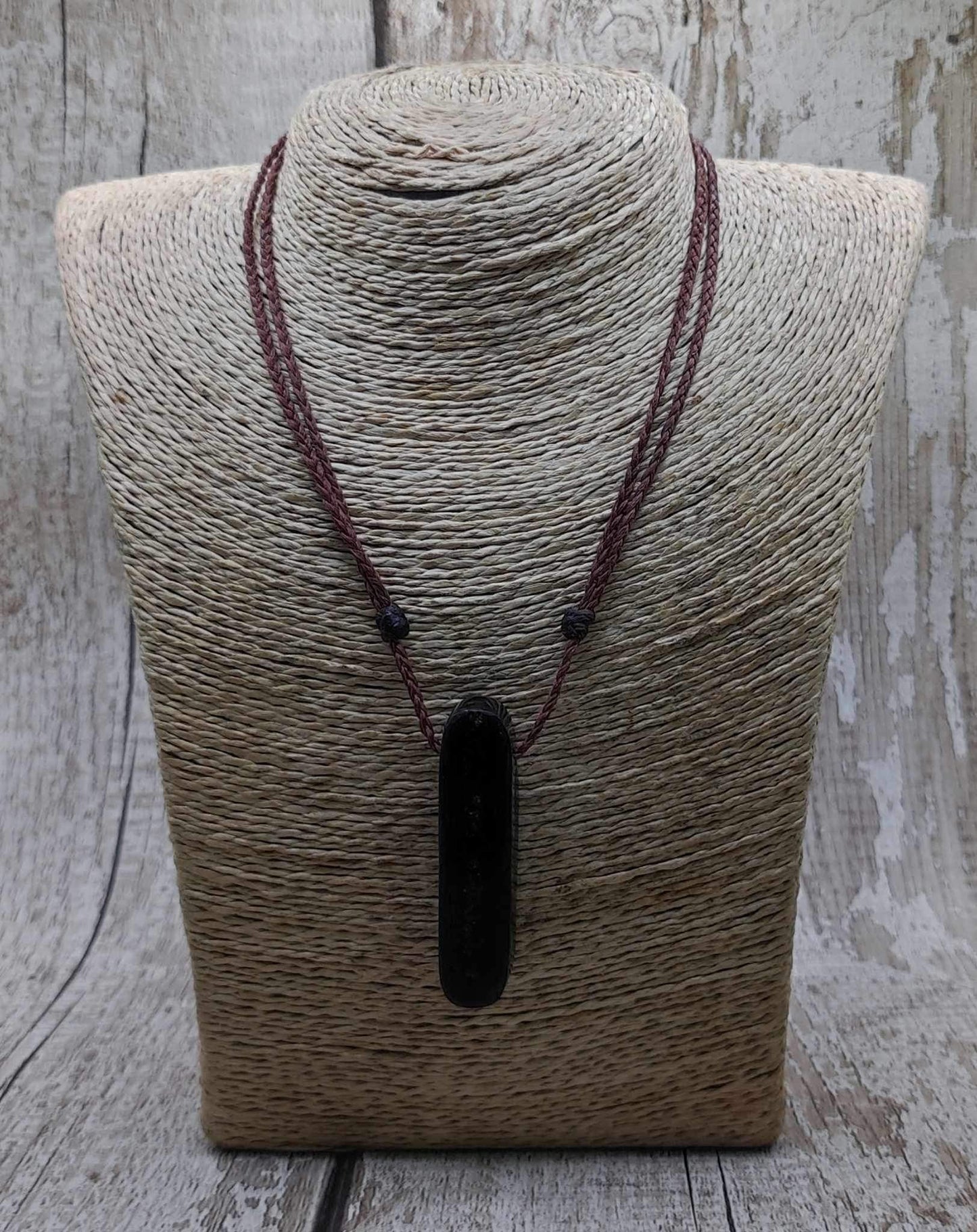 Bog oak and moldavite glass,