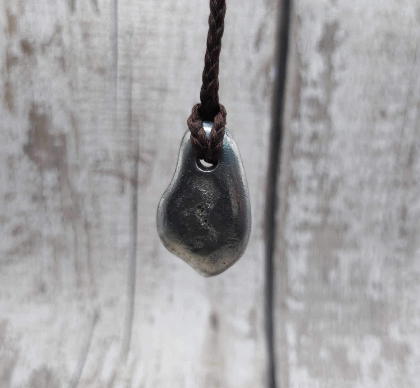 Pewter cast metal ammonite pendant.