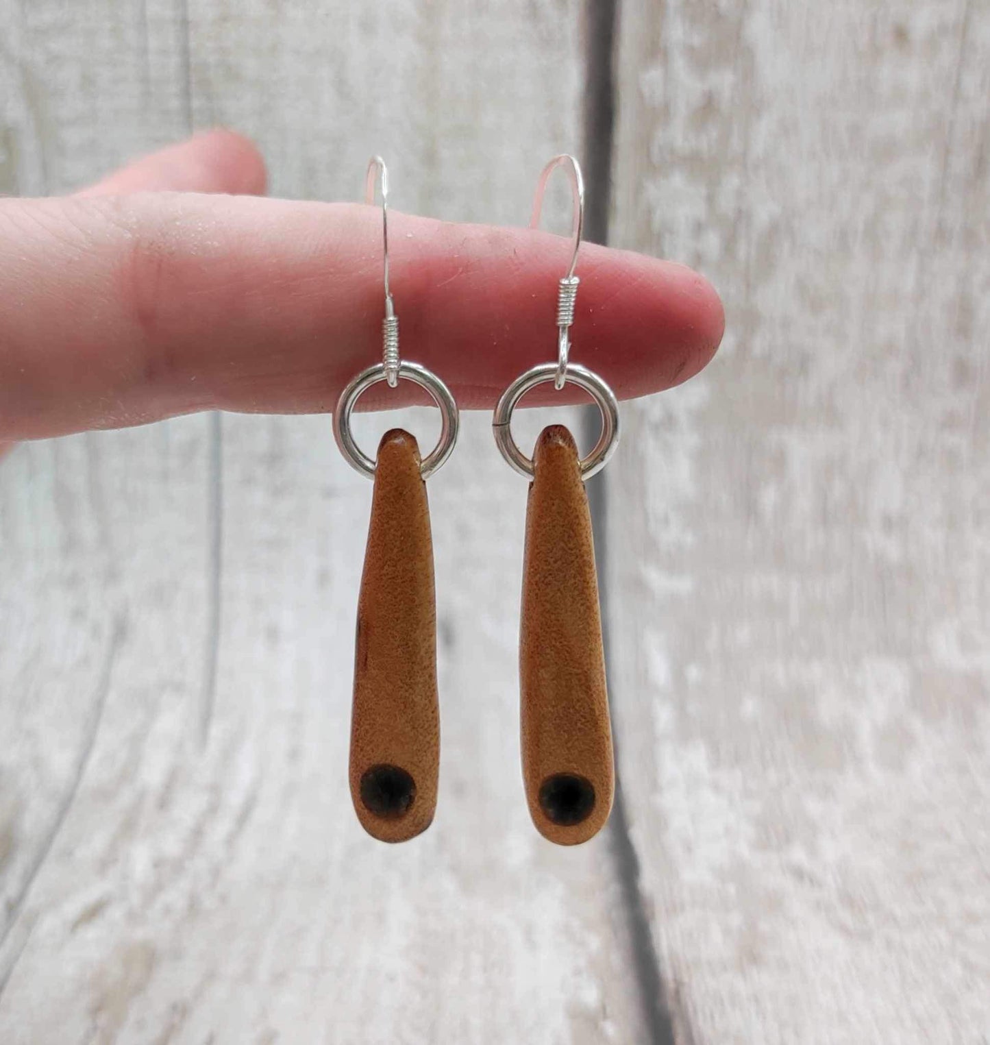 New Zealand swamp kauri wood, roimata earrings, with serpentine Pounamu inlay.