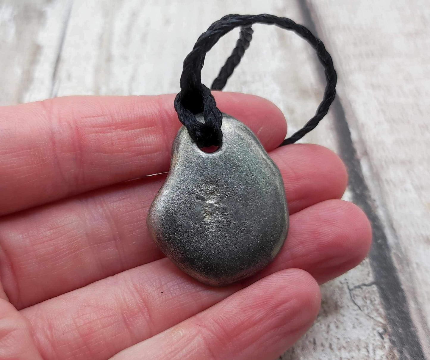 Solid pewter ammonite cast pendant.