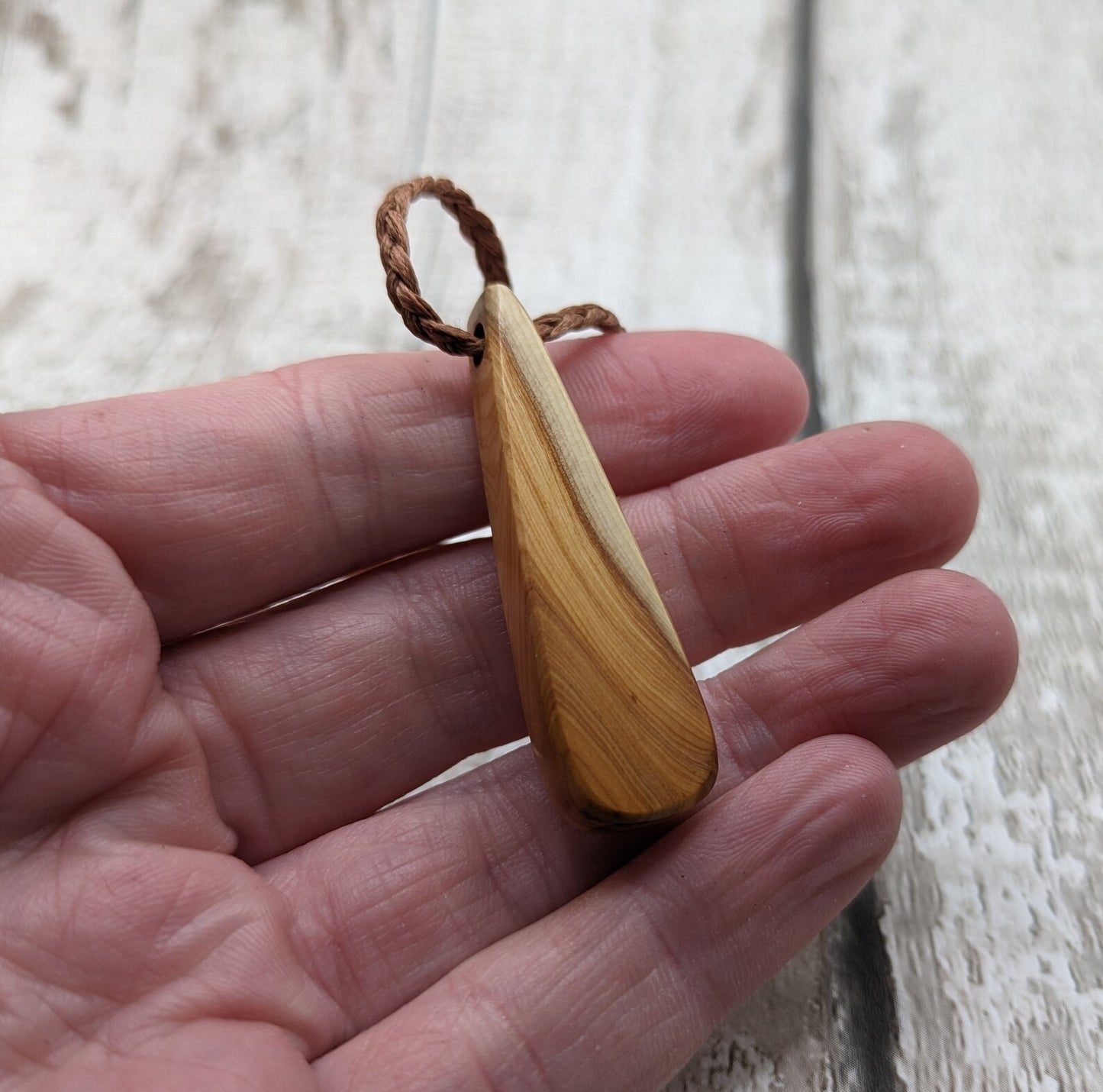 Yew wood roimata drop pendant.