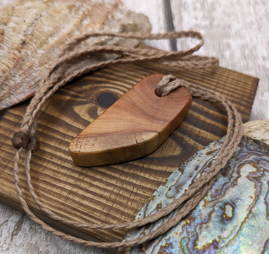 Yew wood slice pendant.