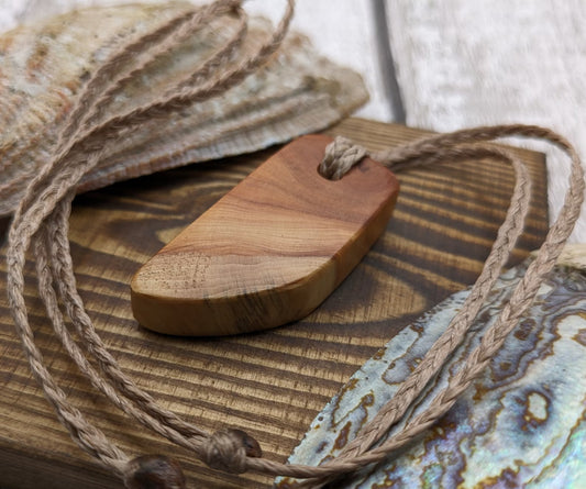 Yew wood slice pendant.