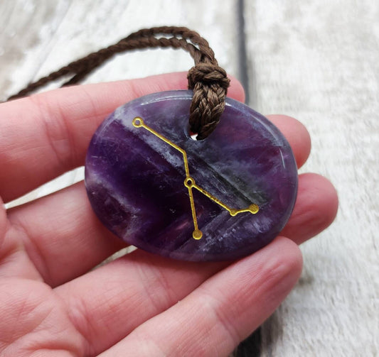 Cancer star sign amethyst drilled palm stone pendant.