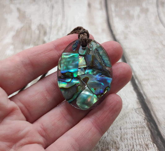 New Zealand Pāua in UV resin pendant.