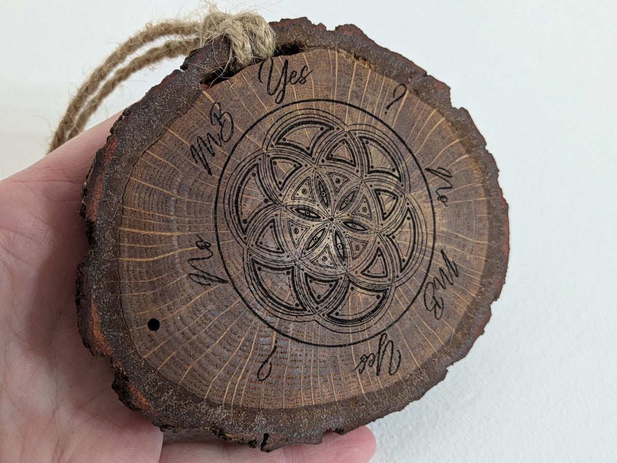 Oak wood slice geometric pattern laser printed pendulum board.