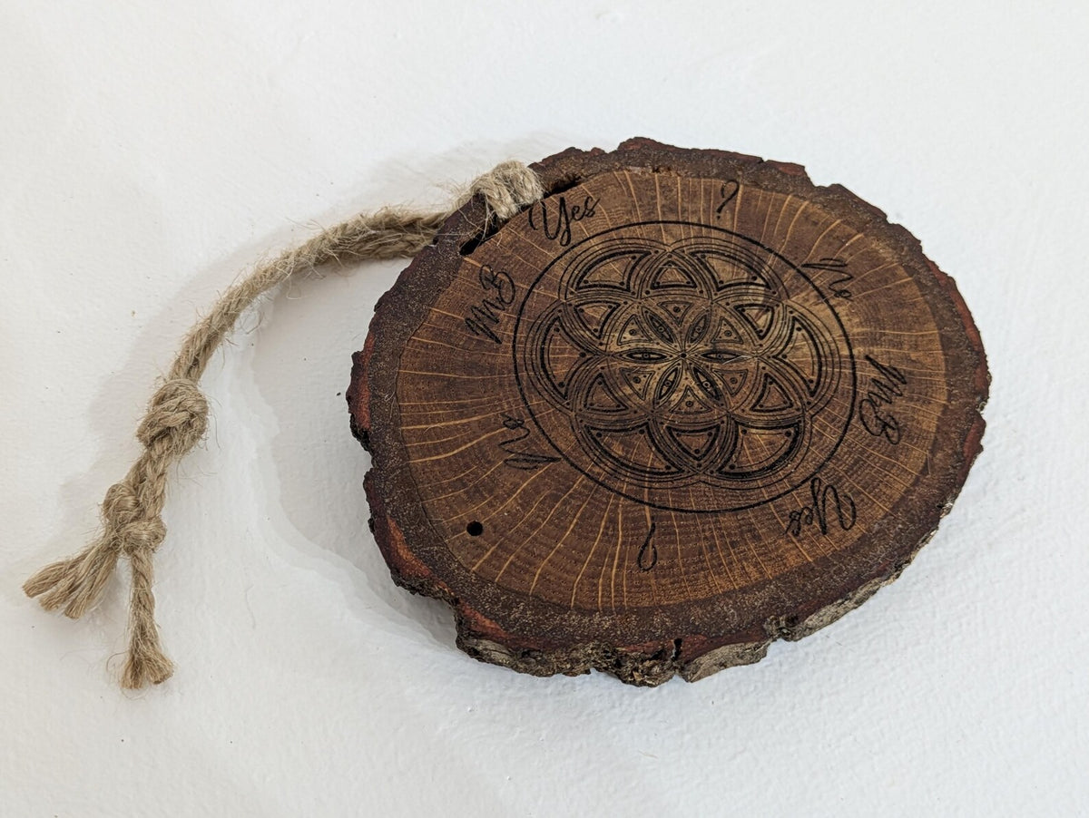 Oak wood slice geometric pattern laser printed pendulum board.