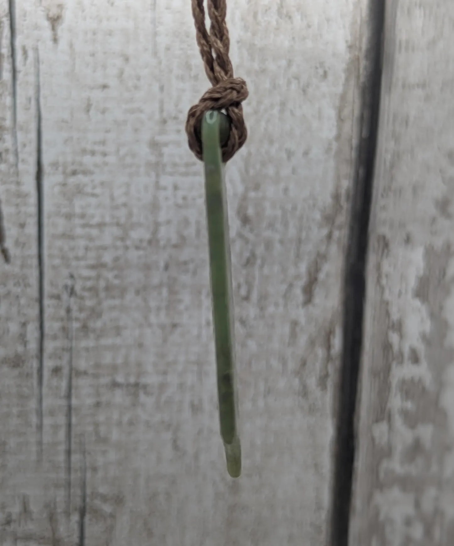 Tumbled Pounamu nephrite jade pendant.