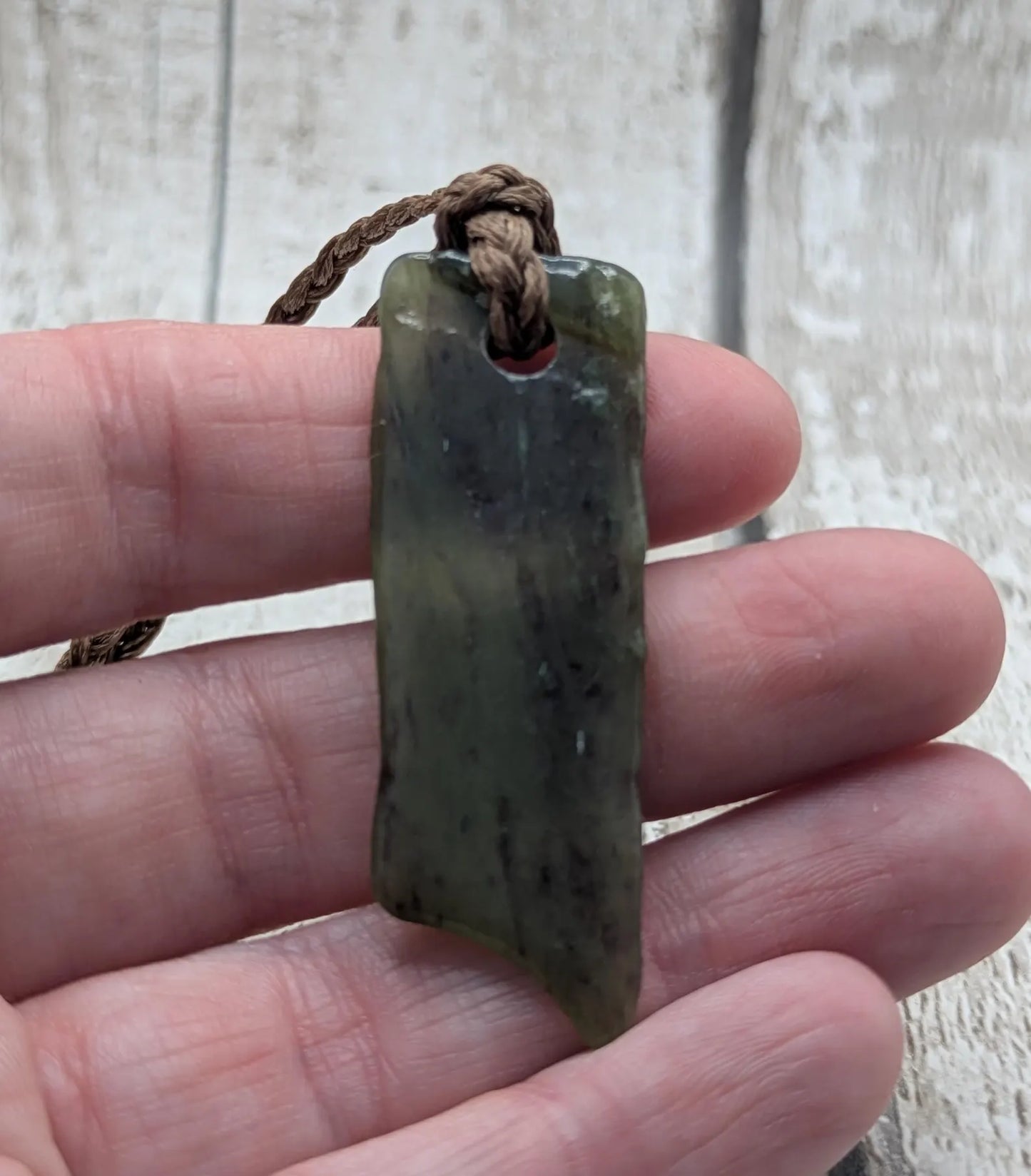 Tumbled Pounamu nephrite jade pendant.