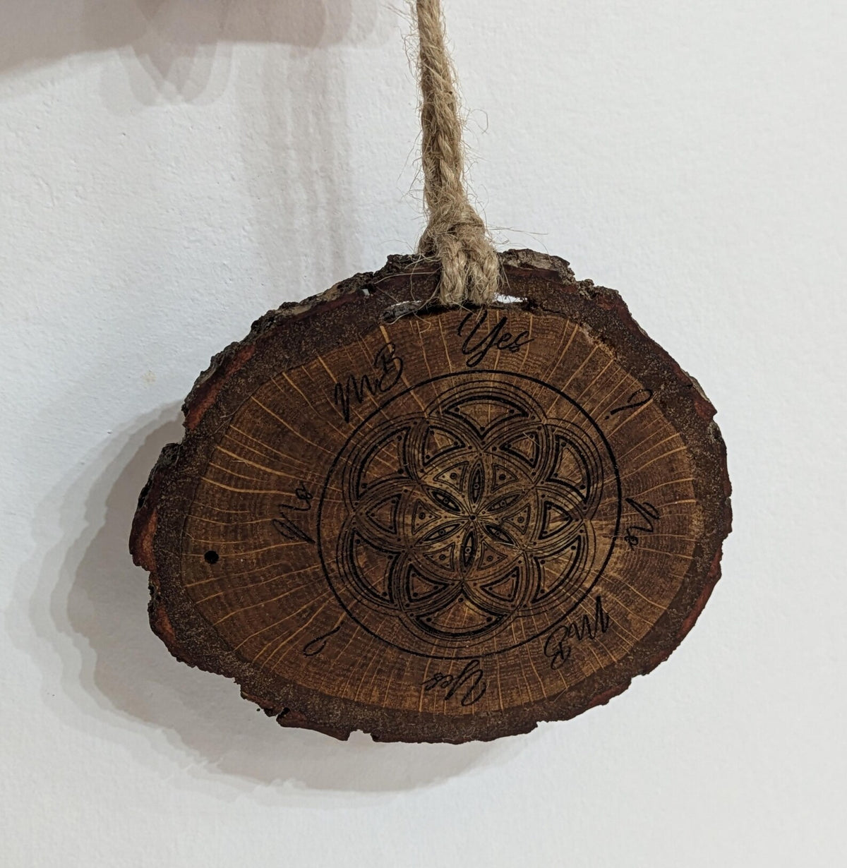Oak wood slice geometric pattern laser printed pendulum board.