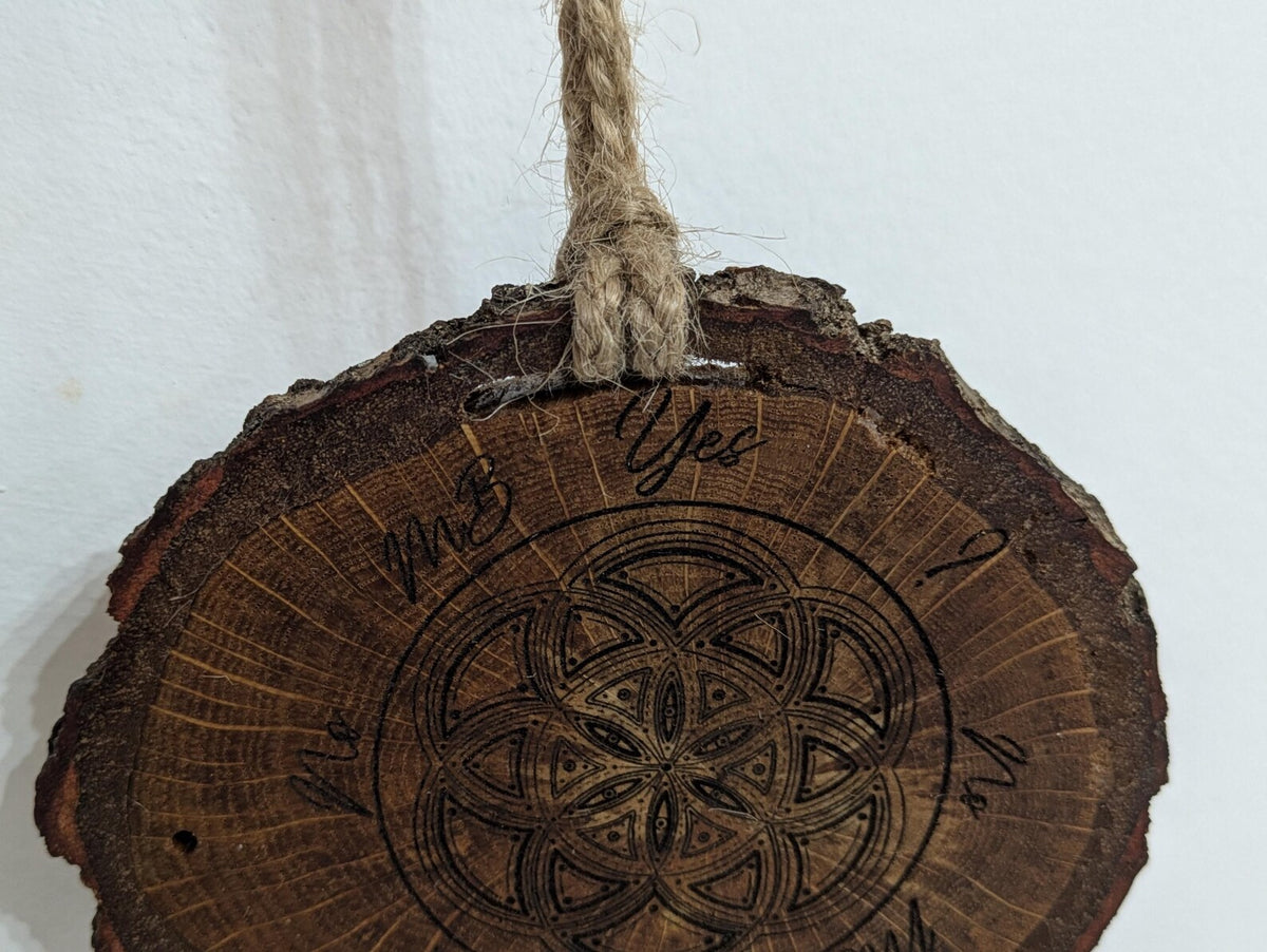Oak wood slice geometric pattern laser printed pendulum board.