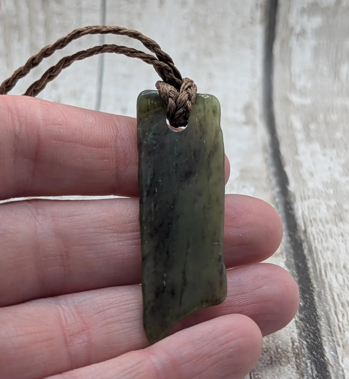 Tumbled Pounamu nephrite jade pendant.