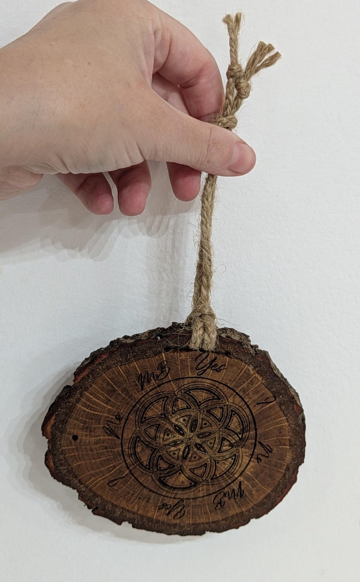 Oak wood slice geometric pattern laser printed pendulum board.