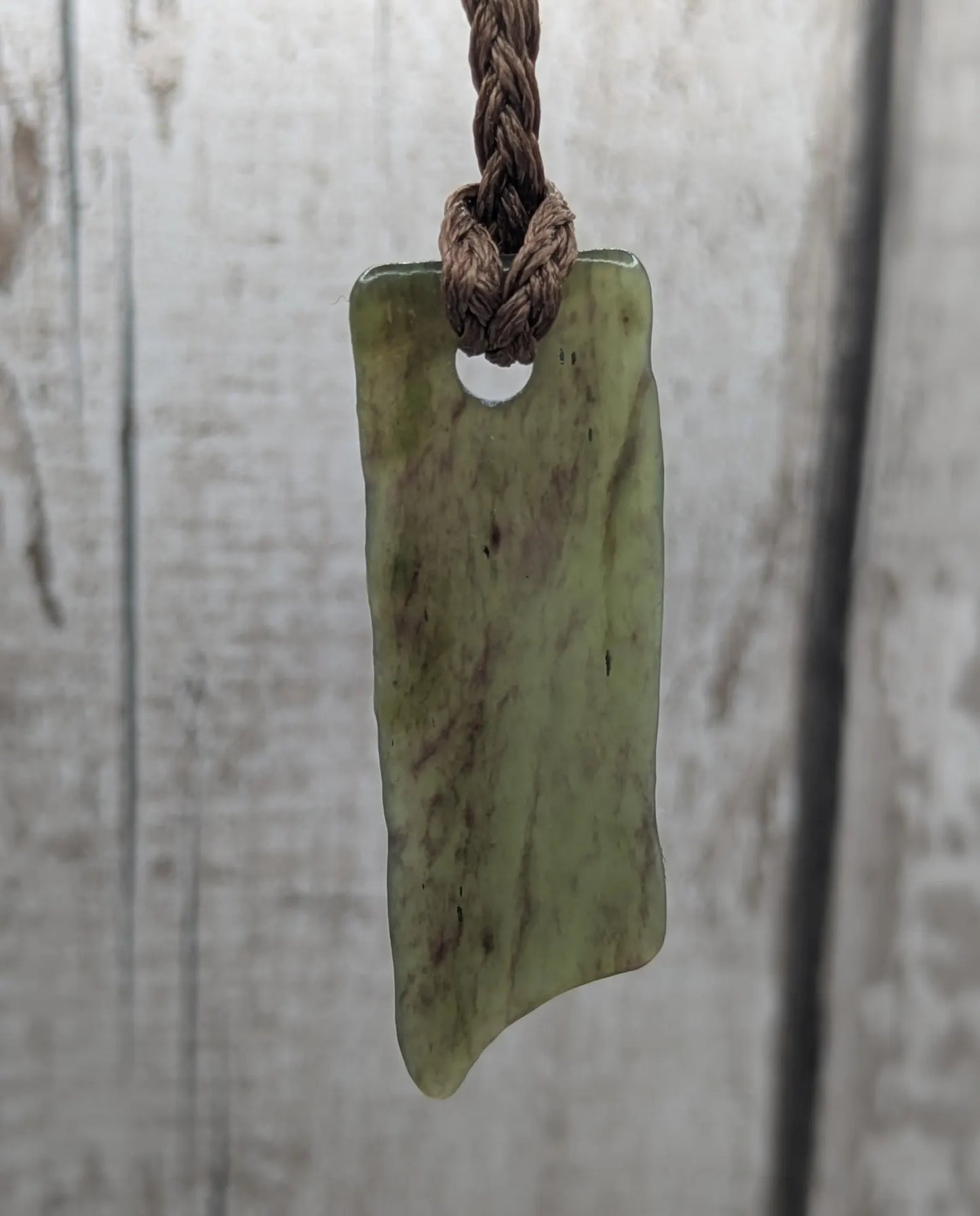 Tumbled Pounamu nephrite jade pendant.