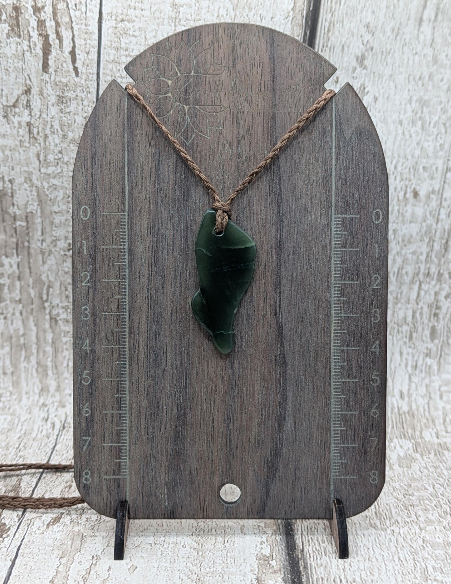 nz tumbled pounamu greenstone jade pendant.