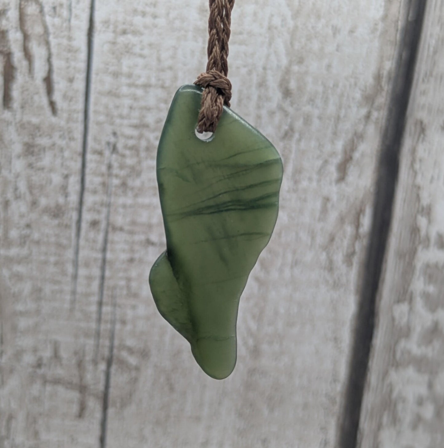 nz tumbled pounamu greenstone jade pendant.