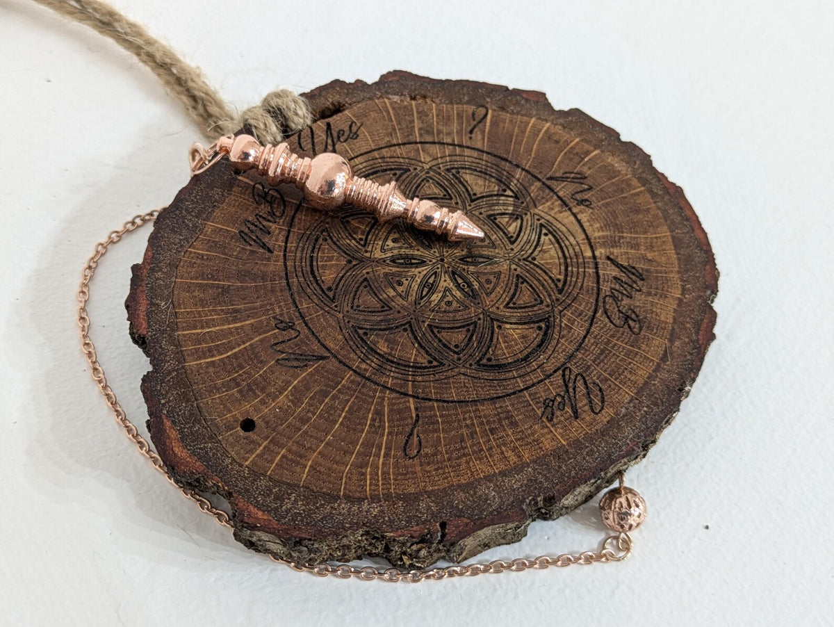 Oak wood slice geometric pattern laser printed pendulum board.