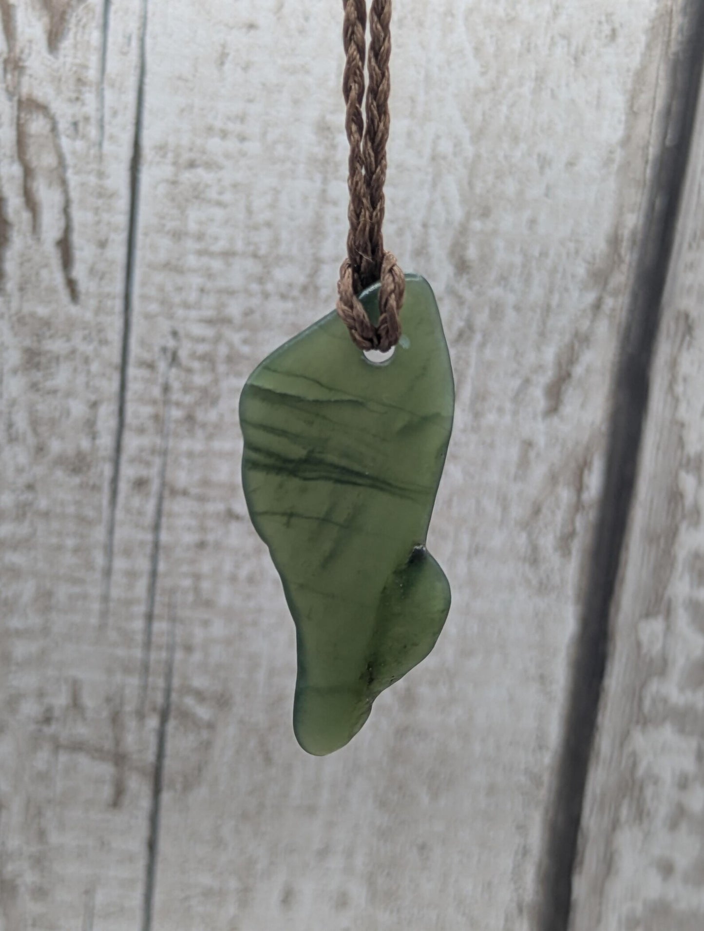 nz tumbled pounamu greenstone jade pendant.