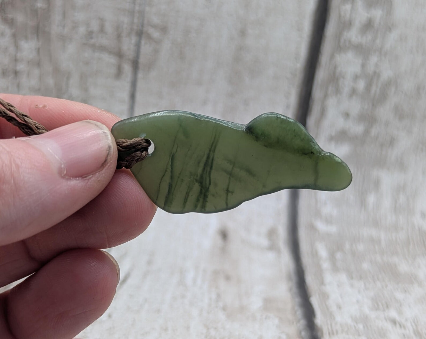 nz tumbled pounamu greenstone jade pendant.