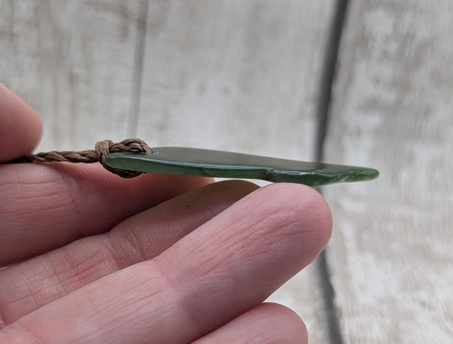 nz tumbled pounamu greenstone jade pendant.