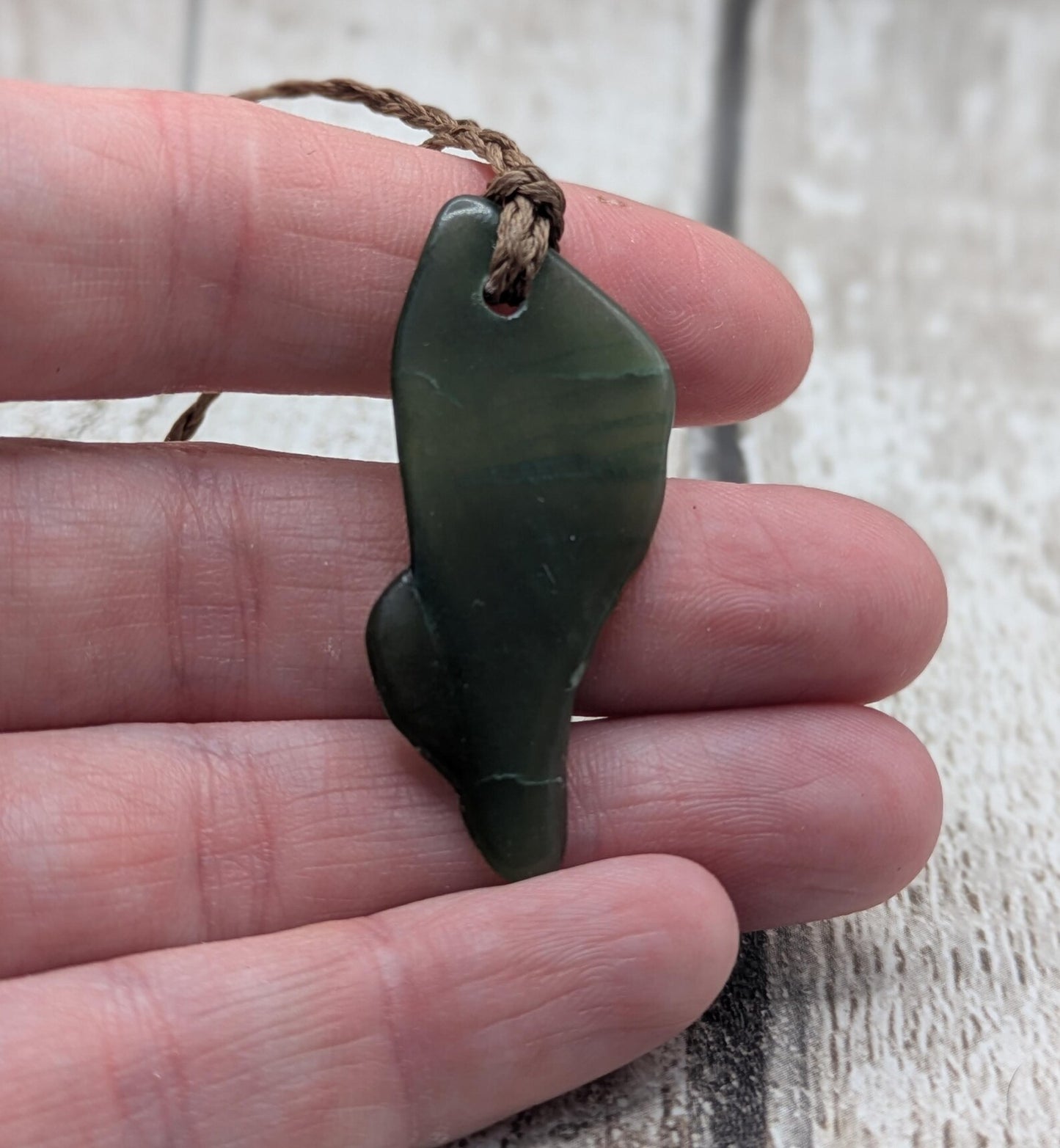 nz tumbled pounamu greenstone jade pendant.