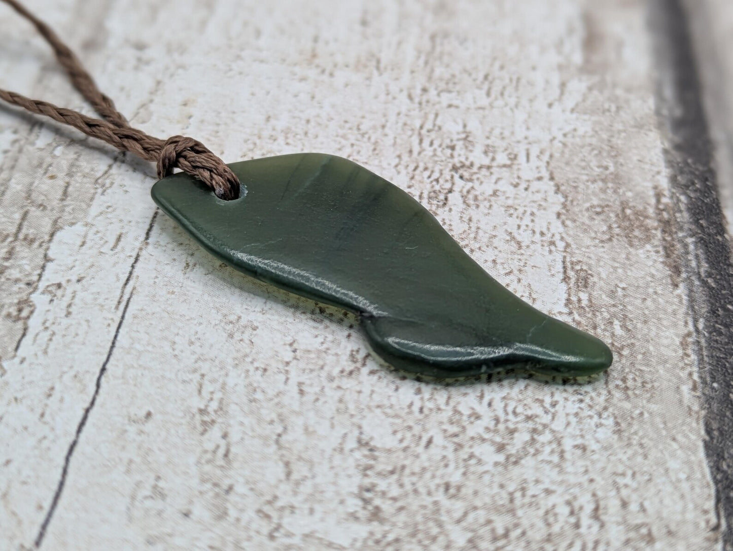 nz tumbled pounamu greenstone jade pendant.