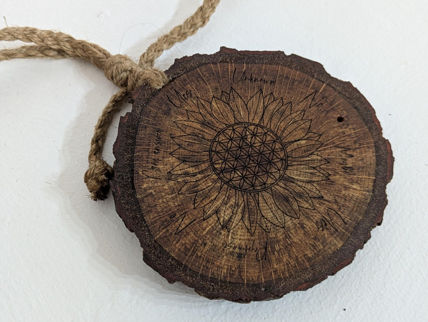 Oak wood slice with sunflower and flower of life laser printed pendulum board.