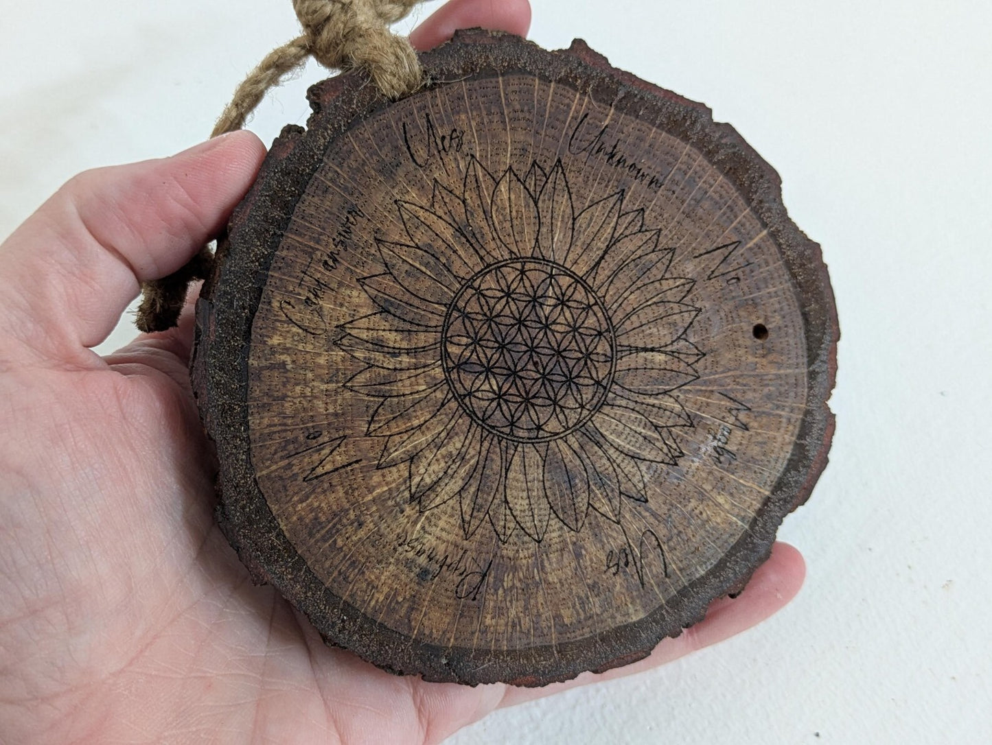 Oak wood slice with sunflower and flower of life laser printed pendulum board.
