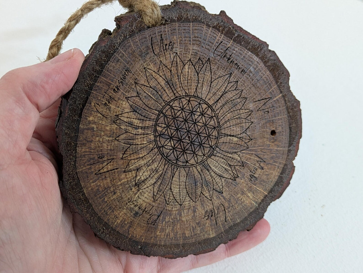 Oak wood slice with sunflower and flower of life laser printed pendulum board.