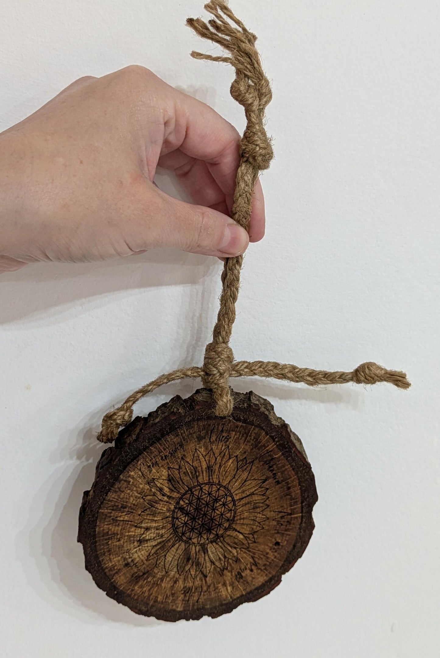 Oak wood slice with sunflower and flower of life laser printed pendulum board.