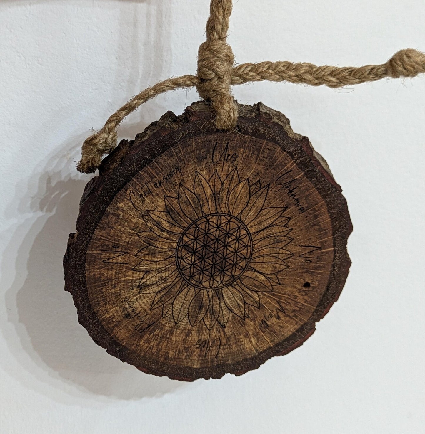 Oak wood slice with sunflower and flower of life laser printed pendulum board.