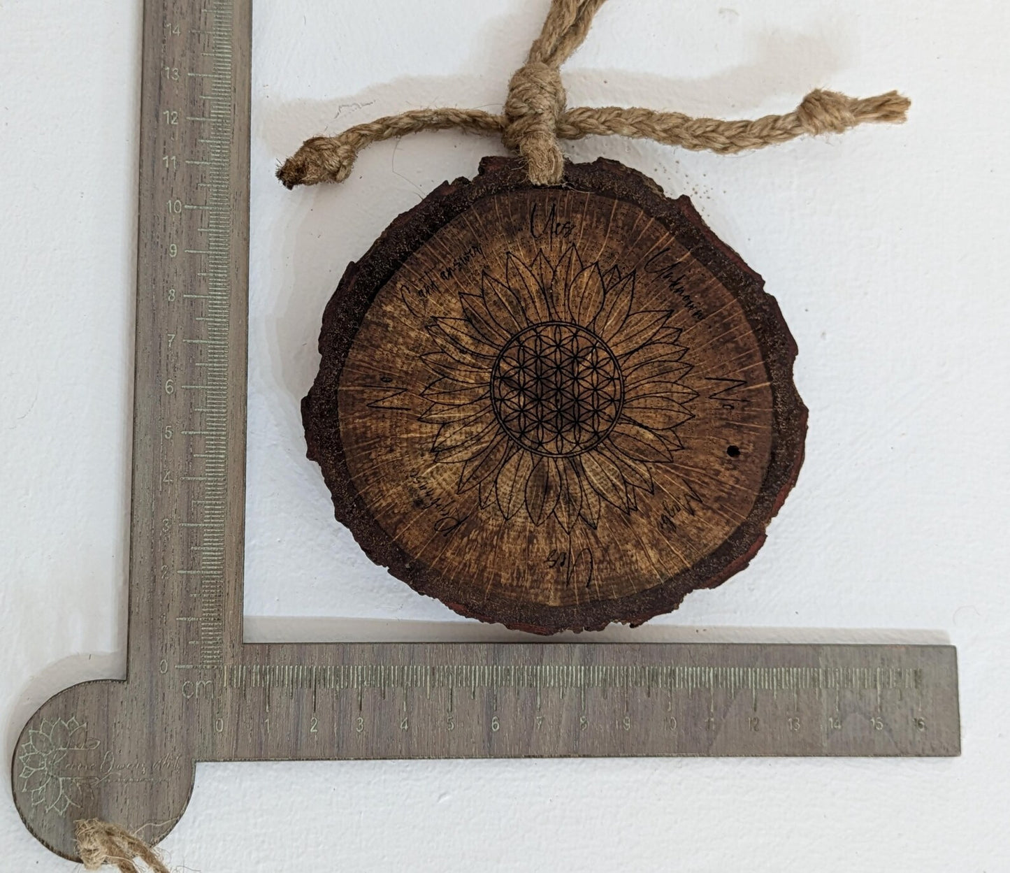 Oak wood slice with sunflower and flower of life laser printed pendulum board.