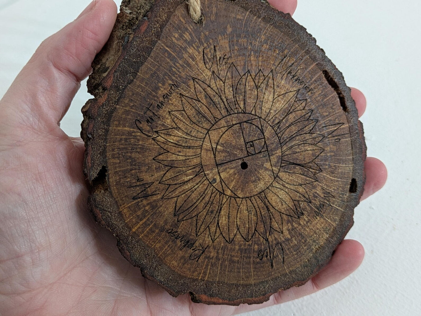 Oak wood slice sunflower and Fibonacci sequence print pendulum board.