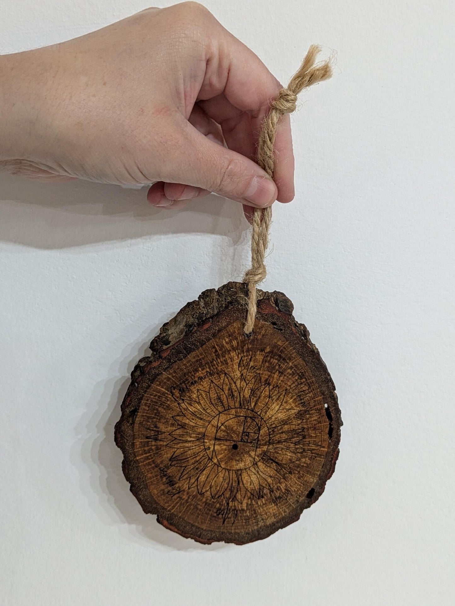 Oak wood slice sunflower and Fibonacci sequence print pendulum board.