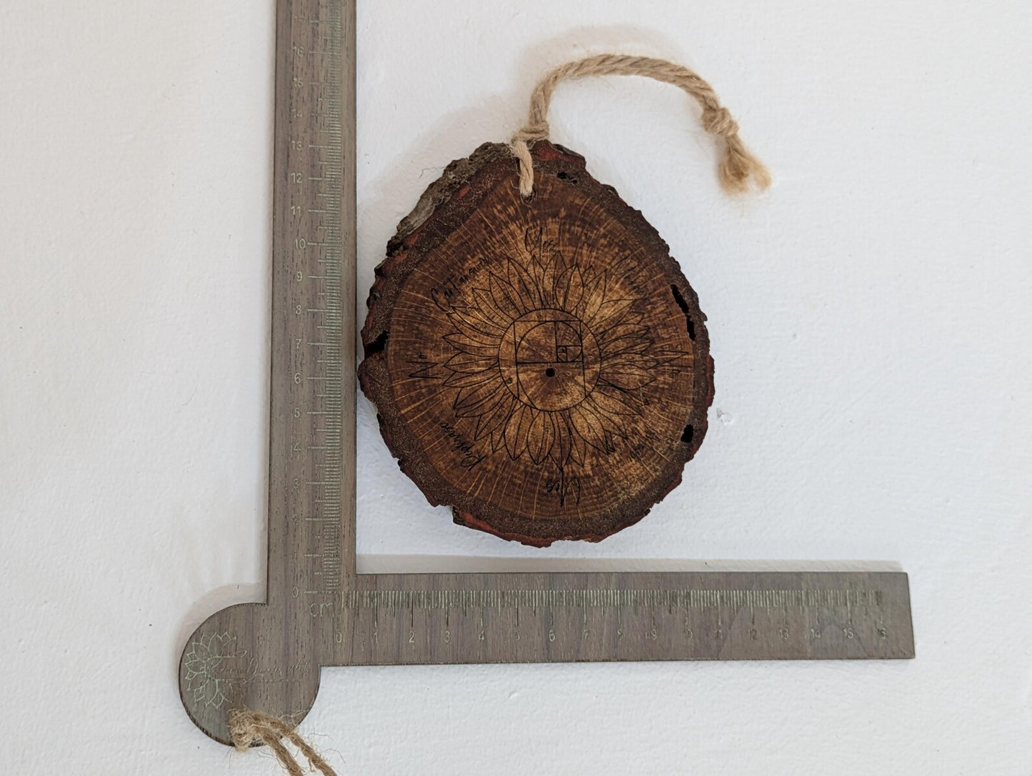Oak wood slice sunflower and Fibonacci sequence print pendulum board.