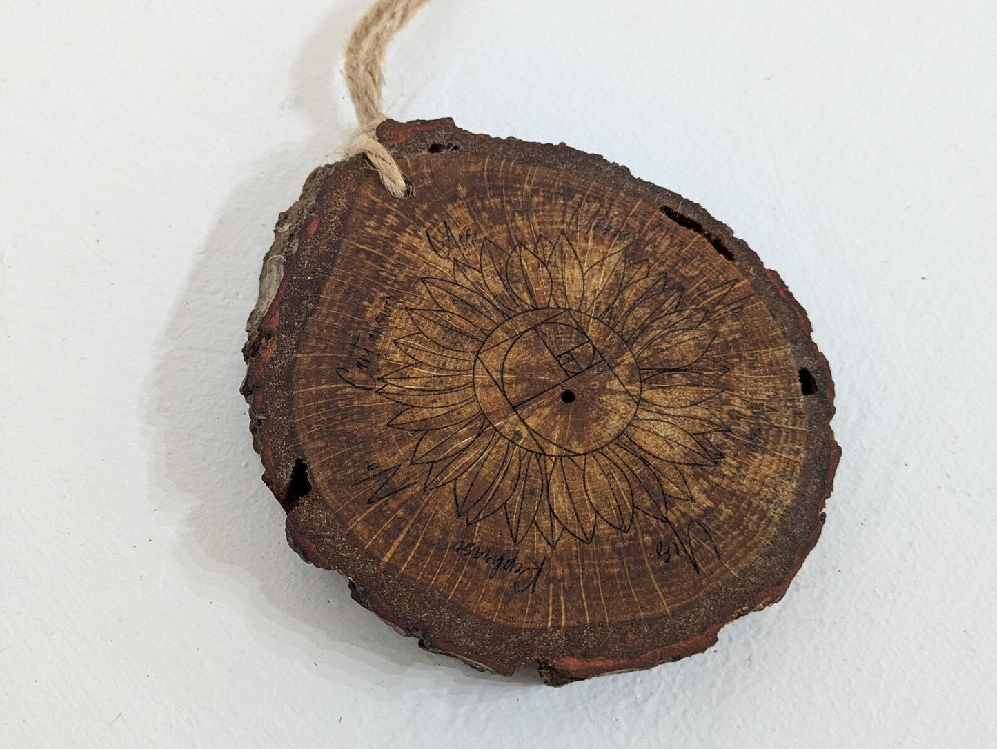 Oak wood slice sunflower and Fibonacci sequence print pendulum board.