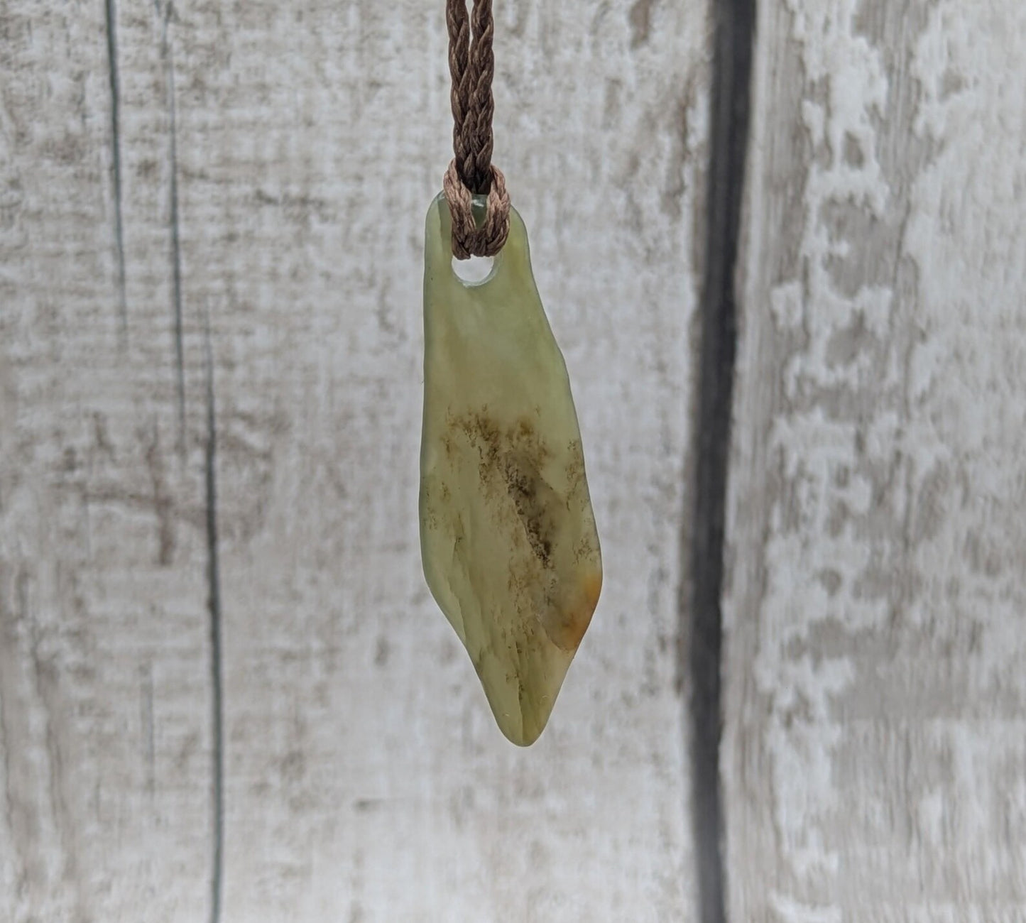 One random Pounamu nephrite jade pendant.