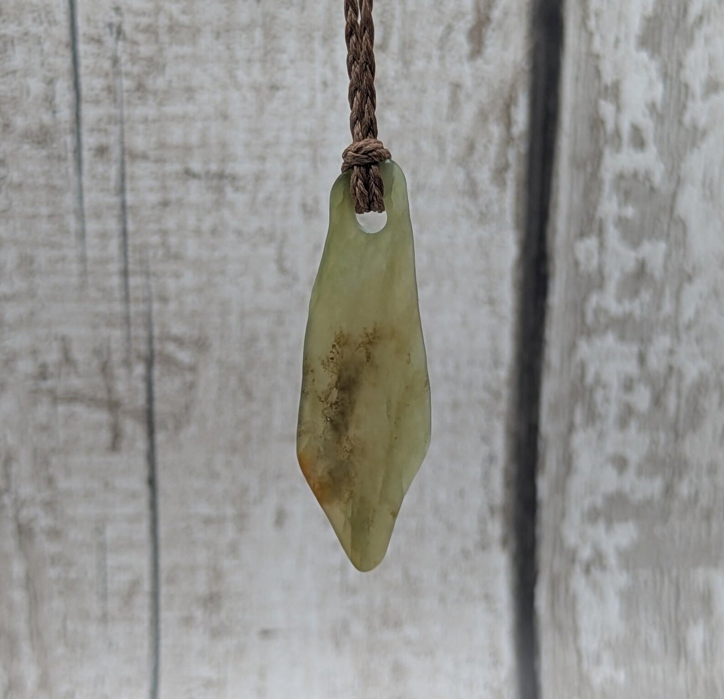 One random Pounamu nephrite jade pendant.