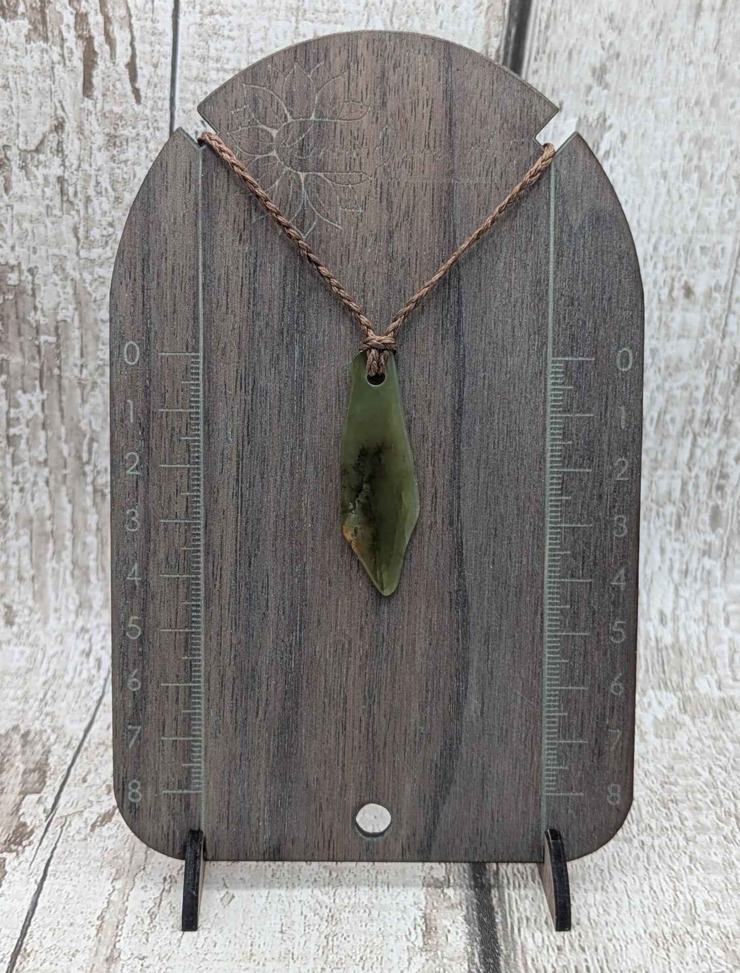 One random Pounamu nephrite jade pendant.