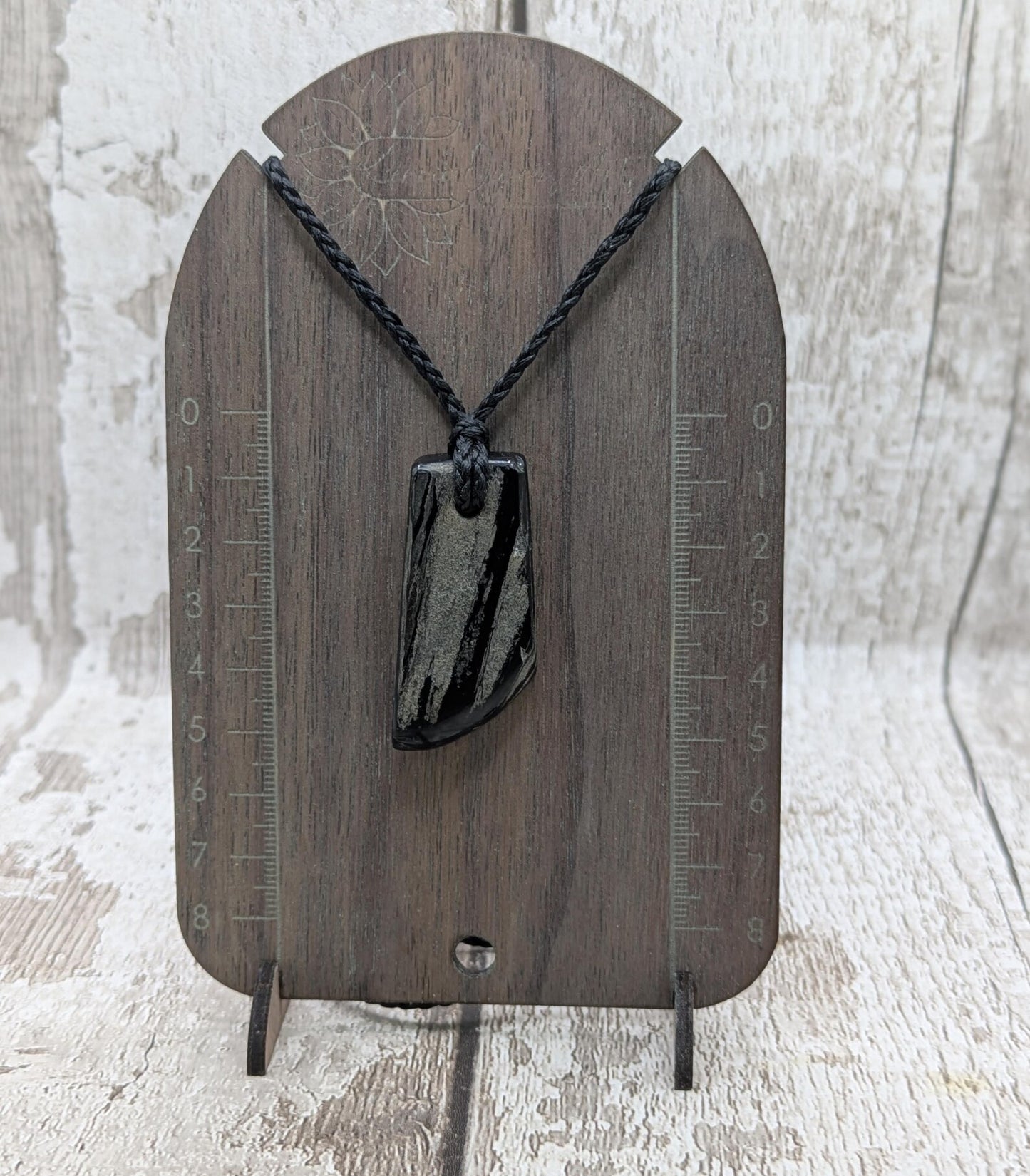 Whitby jet mixed textured polished pendant.