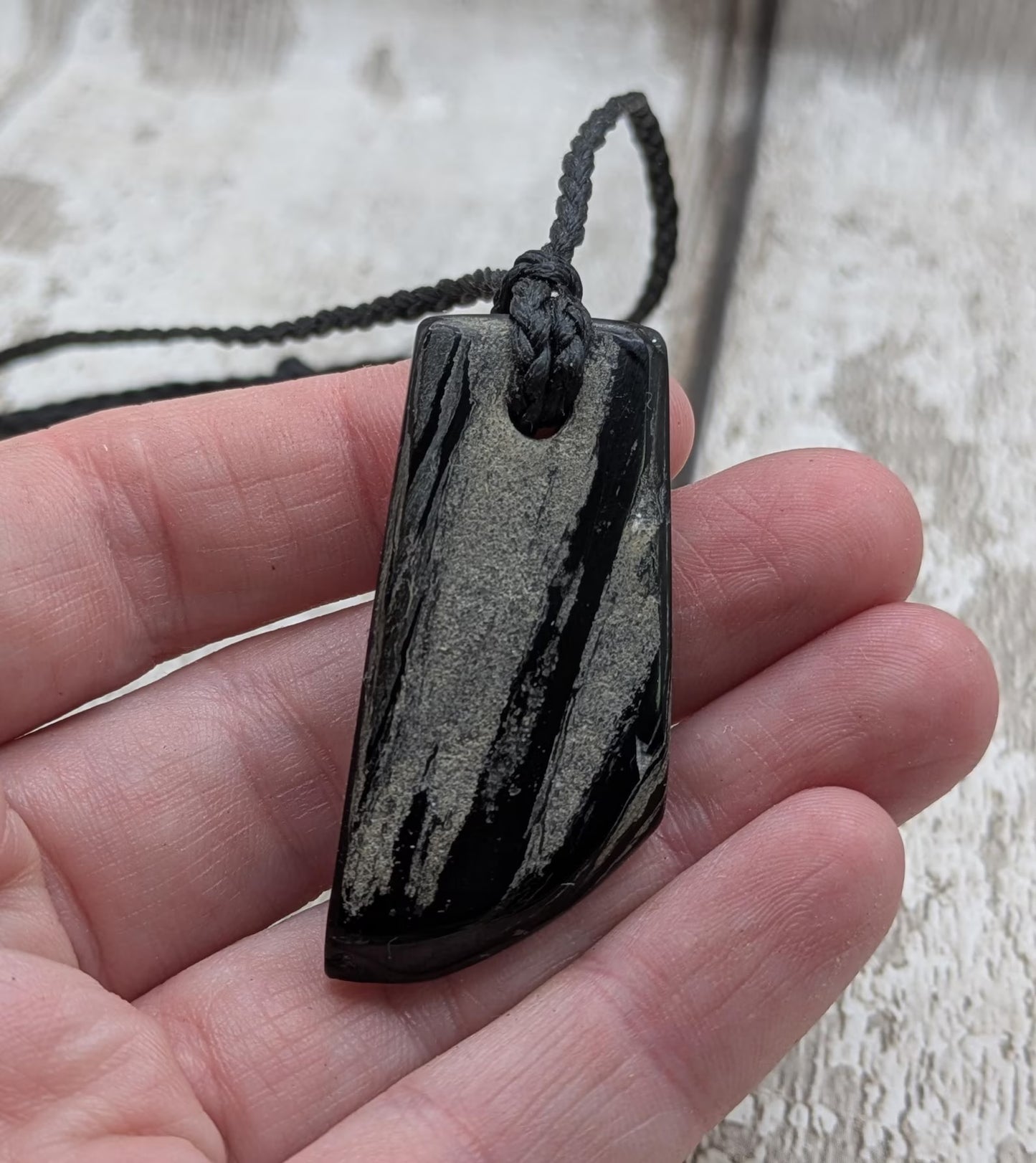 Whitby jet mixed textured polished pendant.