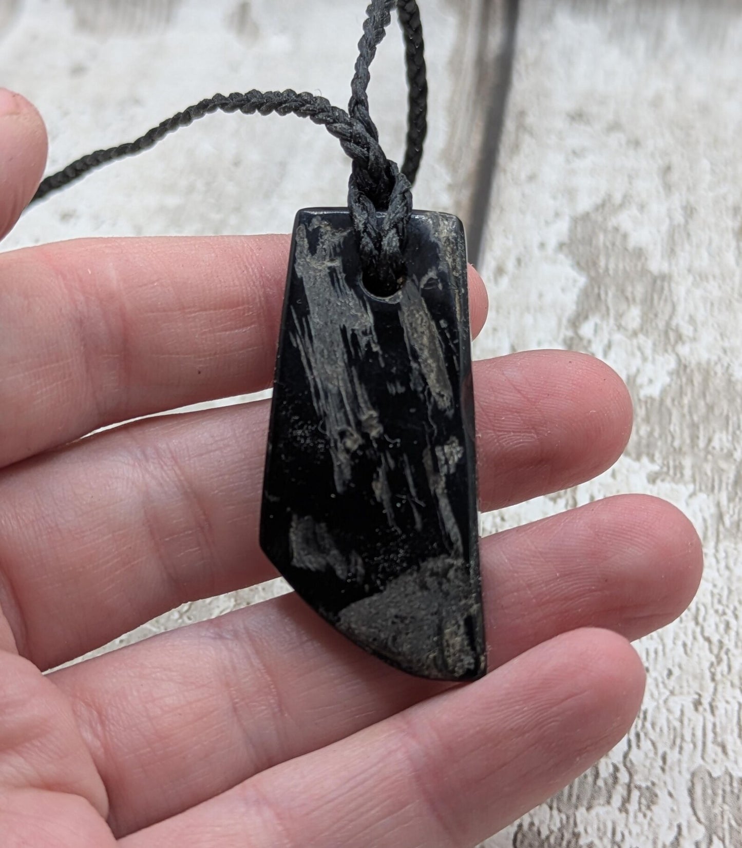Whitby jet mixed textured polished pendant.