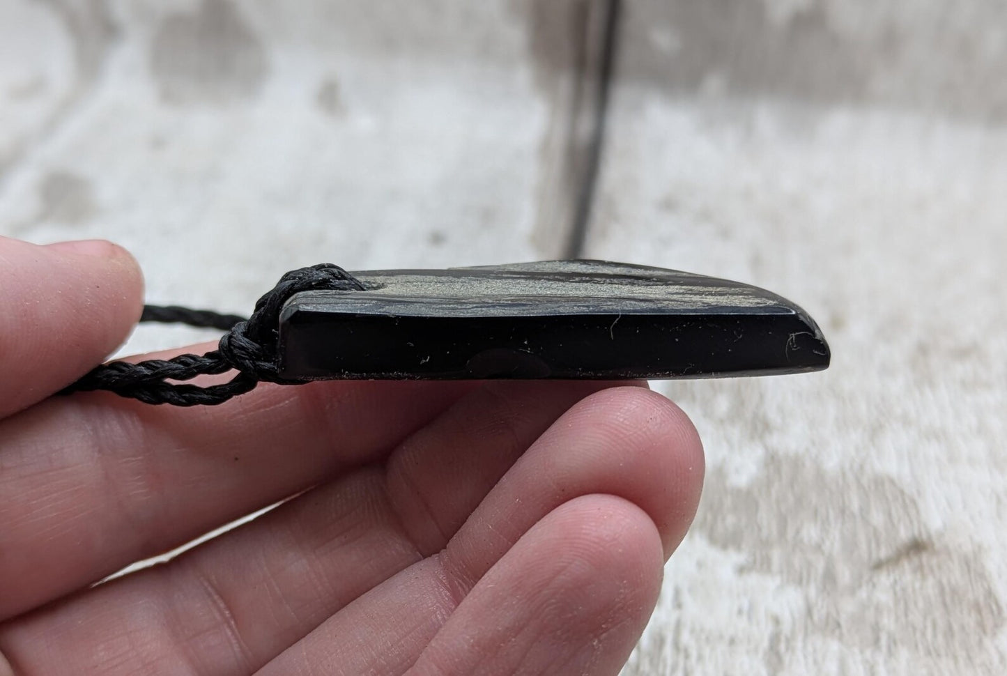 Whitby jet mixed textured polished pendant.
